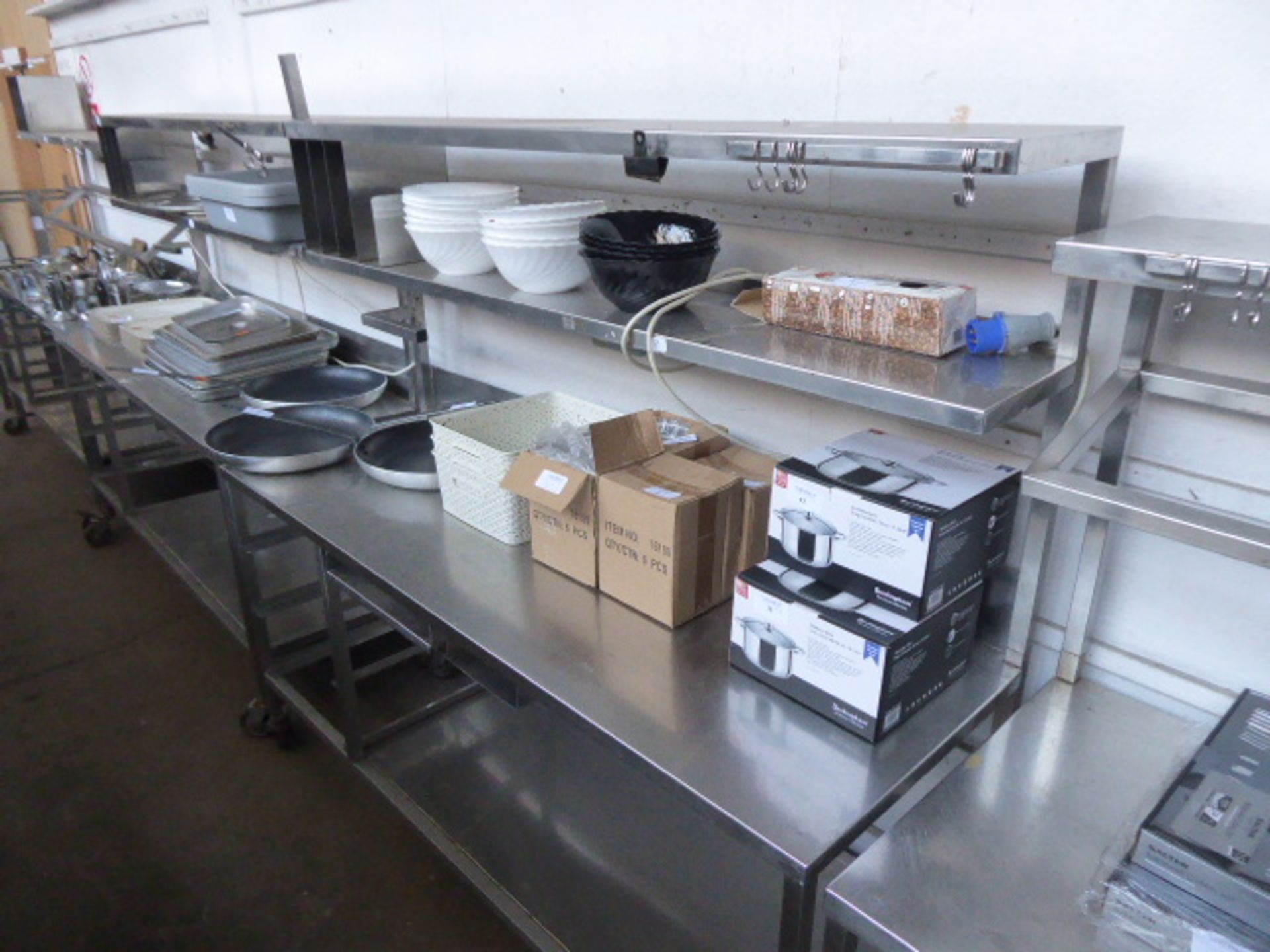 177cm Stainless steel mobile preparation station with two tiers over, shelf under on castors