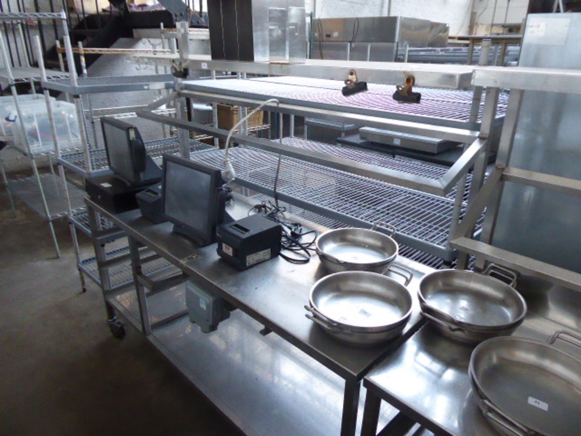 177cm Stainless steel mobile preparation station with two tiers over, shelf under on castors