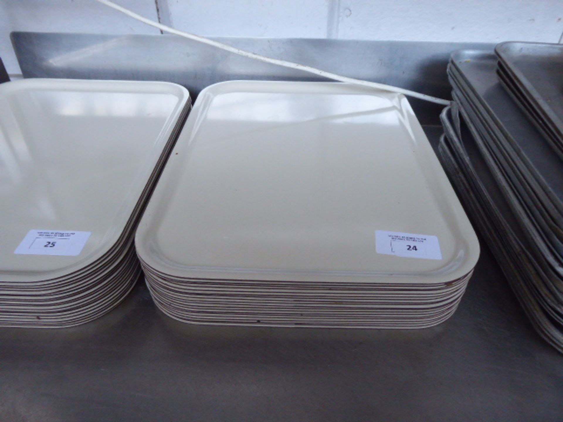 Approximately 19 rectangular serving trays