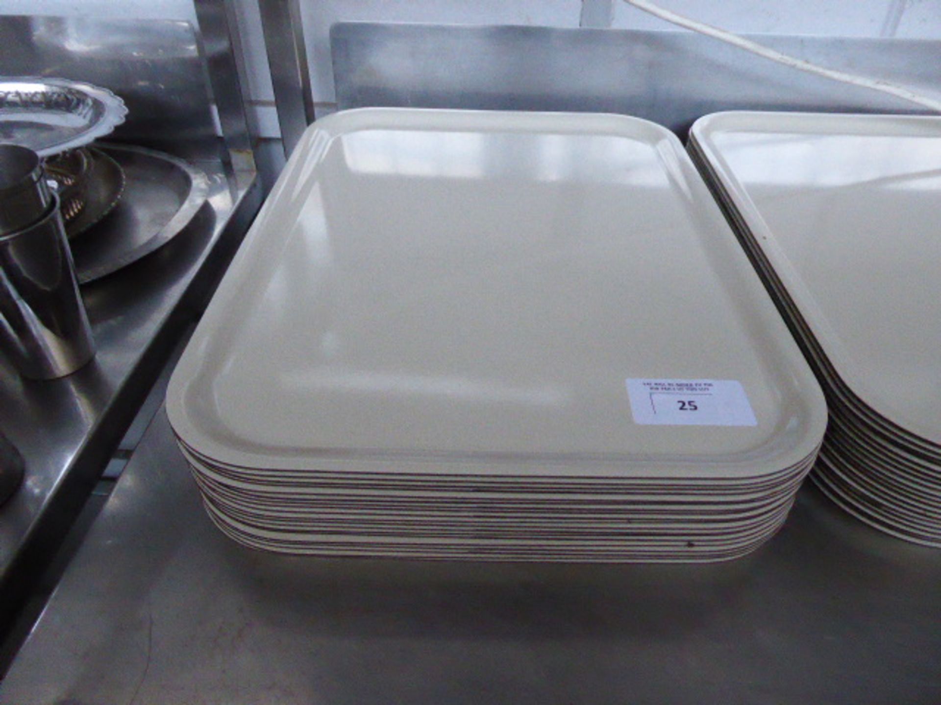 Approximately 19 rectangular serving trays