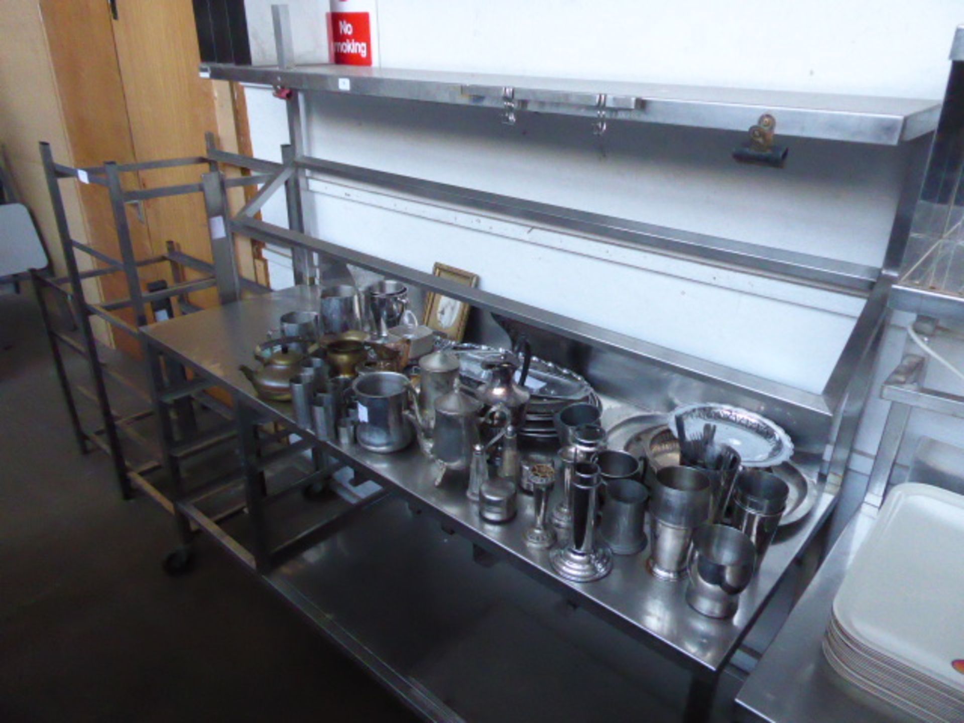 177cm Stainless steel mobile preparation station with two tiers over, shelf under on castors