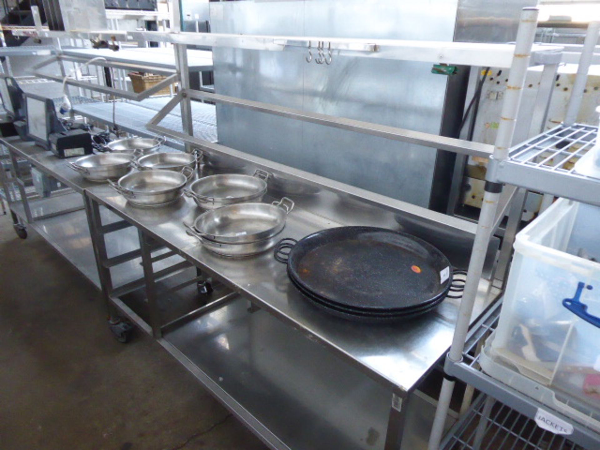 177cm Stainless steel mobile preparation station with two tiers over, shelf under on castors