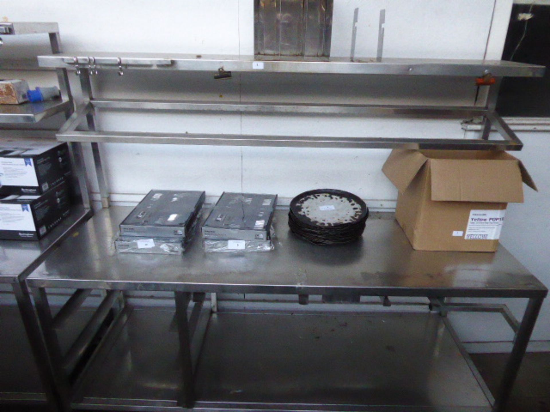 177cm Stainless steel mobile preparation station with two tiers over, shelf under on castors