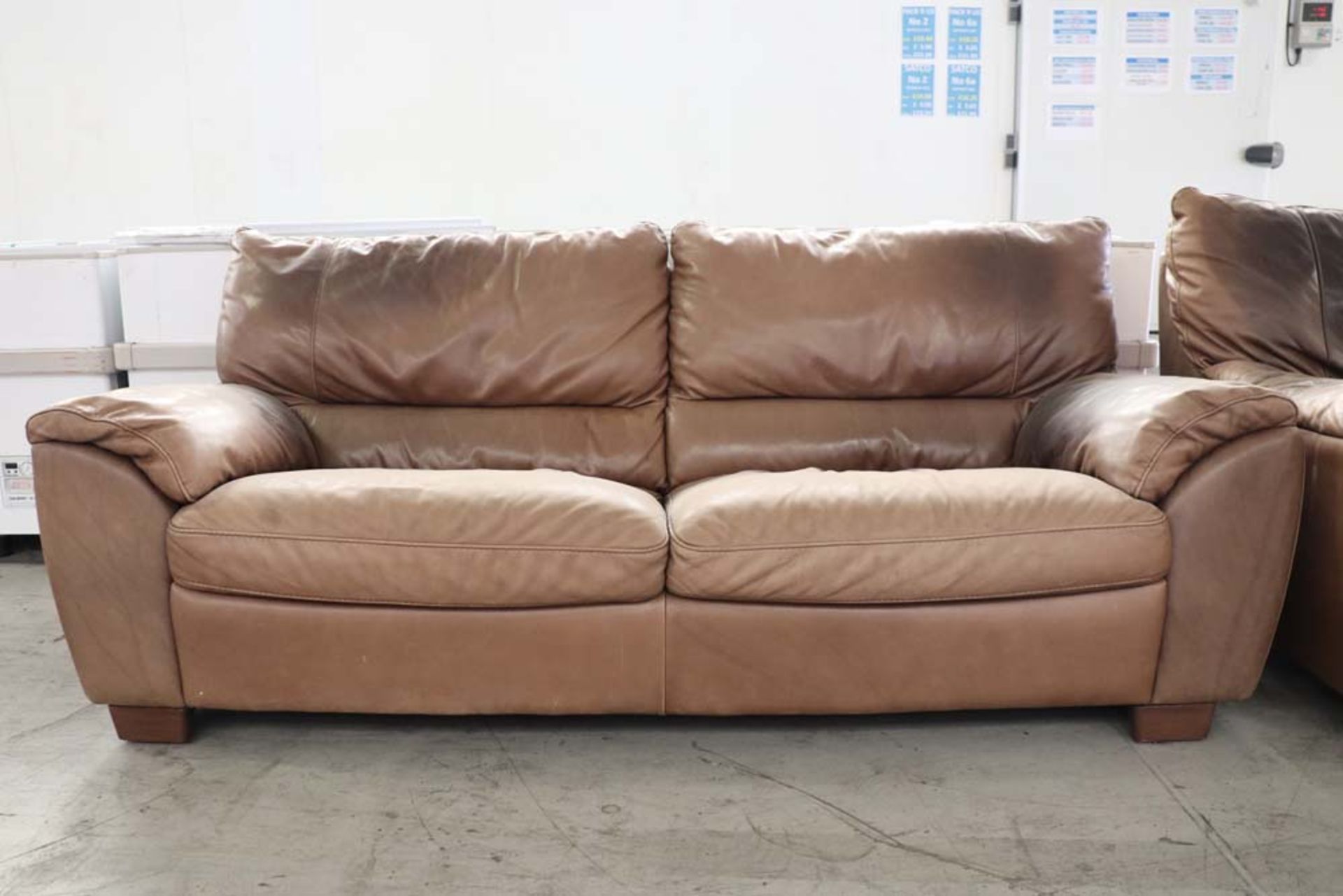 Two 2 seater brown leather sofas