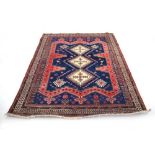 An Iranian multi-coloured carpet,