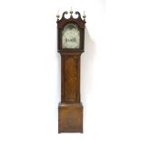 An 18th century longcase clock, the painted face with a moon phase, secondary dial,