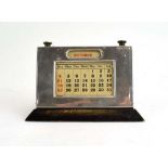 An early 20th century silver mounted desk calendar of rectangular form, maker WJM & Co.