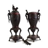 A pair of Japanese brown patinated bronze covered vases of baluster form having a foo dog finial