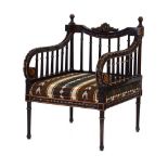 A Continental walnut and ebonised armchair with scrolled arms and spindle supports,