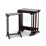 A nest of four mahogany, strung and crossbanded quartetto tables with raised rims,