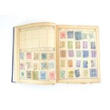 A partial album of late 19th century/early 20th century world stamps including
