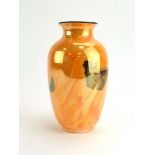 A Ducal lusterware vase of ovoid form decorated with a hummingbird and butterflies on an orange