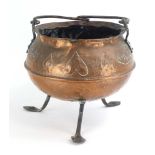 An Arts & Crafts copper cauldron with an inscribed foliate and heart border,