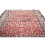 An Iranian red floral carpet,