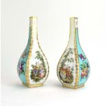 A pair of early 20th century bottle vases of canted form,