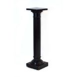An ebonised plinth or torchere in the form of a classical pillar, h.
