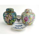 A cloisonne jar and cover decorated with flowering shrubs on a blue ground, h.