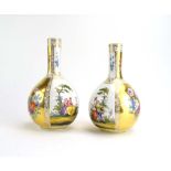 A pair of early 20th century bottle vases of canted form,