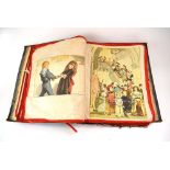 A Victorian album, the fabric pages with coloured engravings and other images,