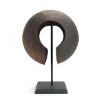 A copper sculpture of squat round form on a black stand, h.