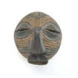 A Luba, Congo, mask with geometric lines and pale golden sigment, h.