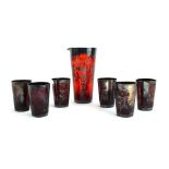 A Bohemian ruby glass and metalware overlaid jug and six matching beakers (7)