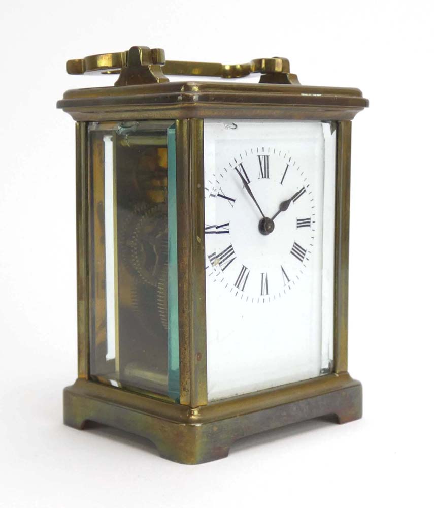 An early 20th century French carriage timepiece, the enamelled face with Roman numerals,