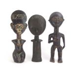 Three carved fertility figures,