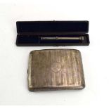 A silver and parcel gilt cigarette case of cushioned rectangular form, A&J Zimmerman,