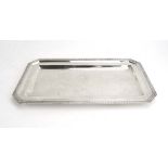 An Austrian metalware tray of canted rectangular form with leaf design border, w.