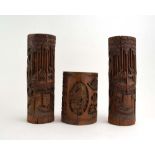 A pair of Chinese carved bamboo brush pots, typically decorated with figures at leisure, h. 30.