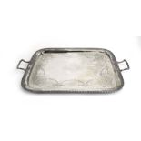 An Edwardian silver two handled tray of cushioned rectangular form,