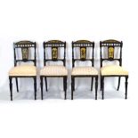 A set of four Aesthetic Movement ebonised and gilt highlighted parlour chairs,
