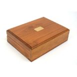 A walnut humidor containing Havana Milds cigars, Black Russian cigarettes etc.