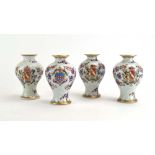 A set of four Chinese armorial miniature vases of baluster form,