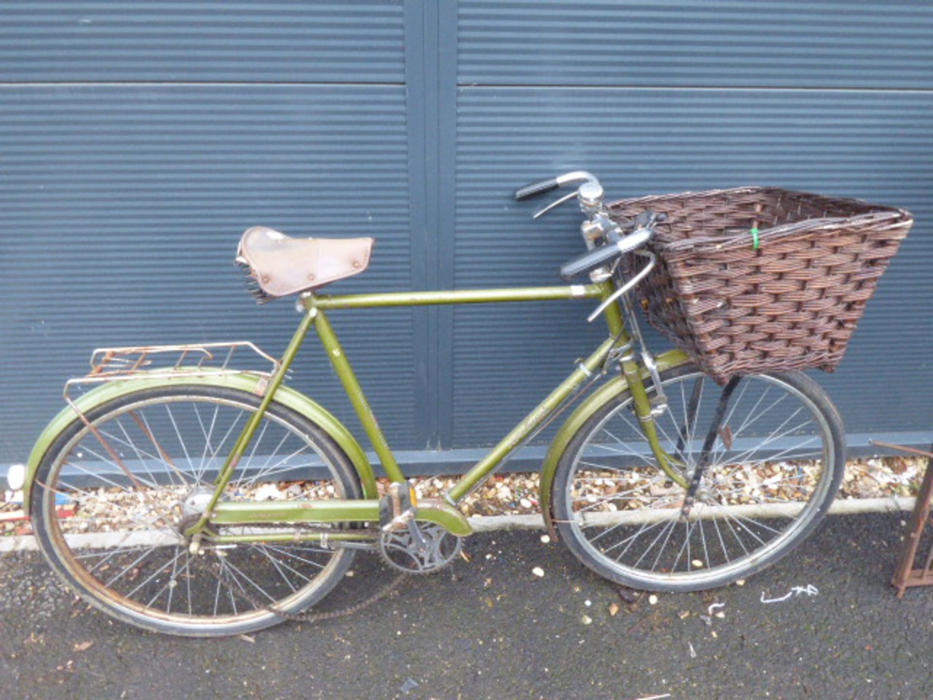 Green vintage Raleigh gents bike with front basket