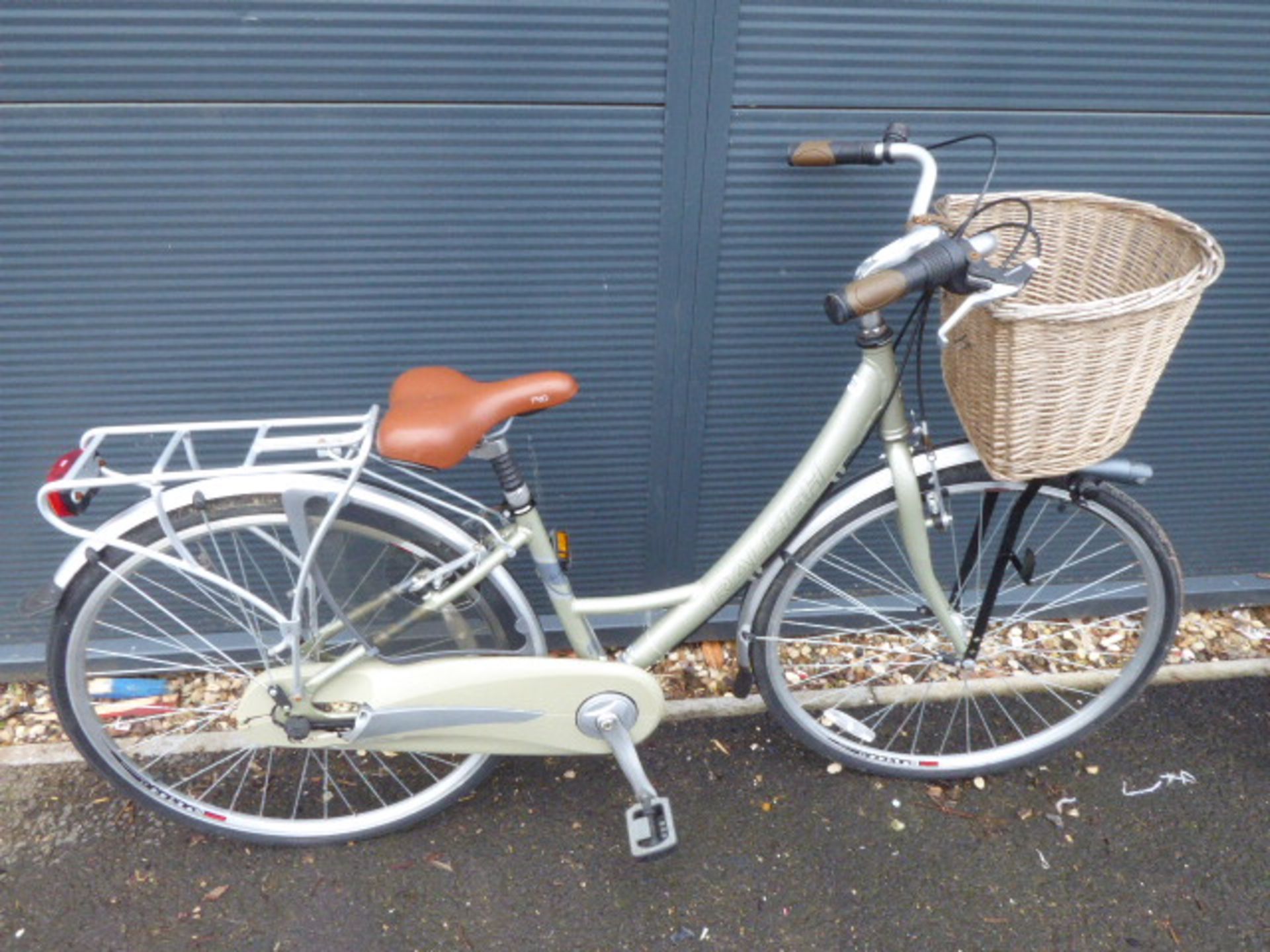 Light green ladies Raleigh Elegance bike with back rack and front basket