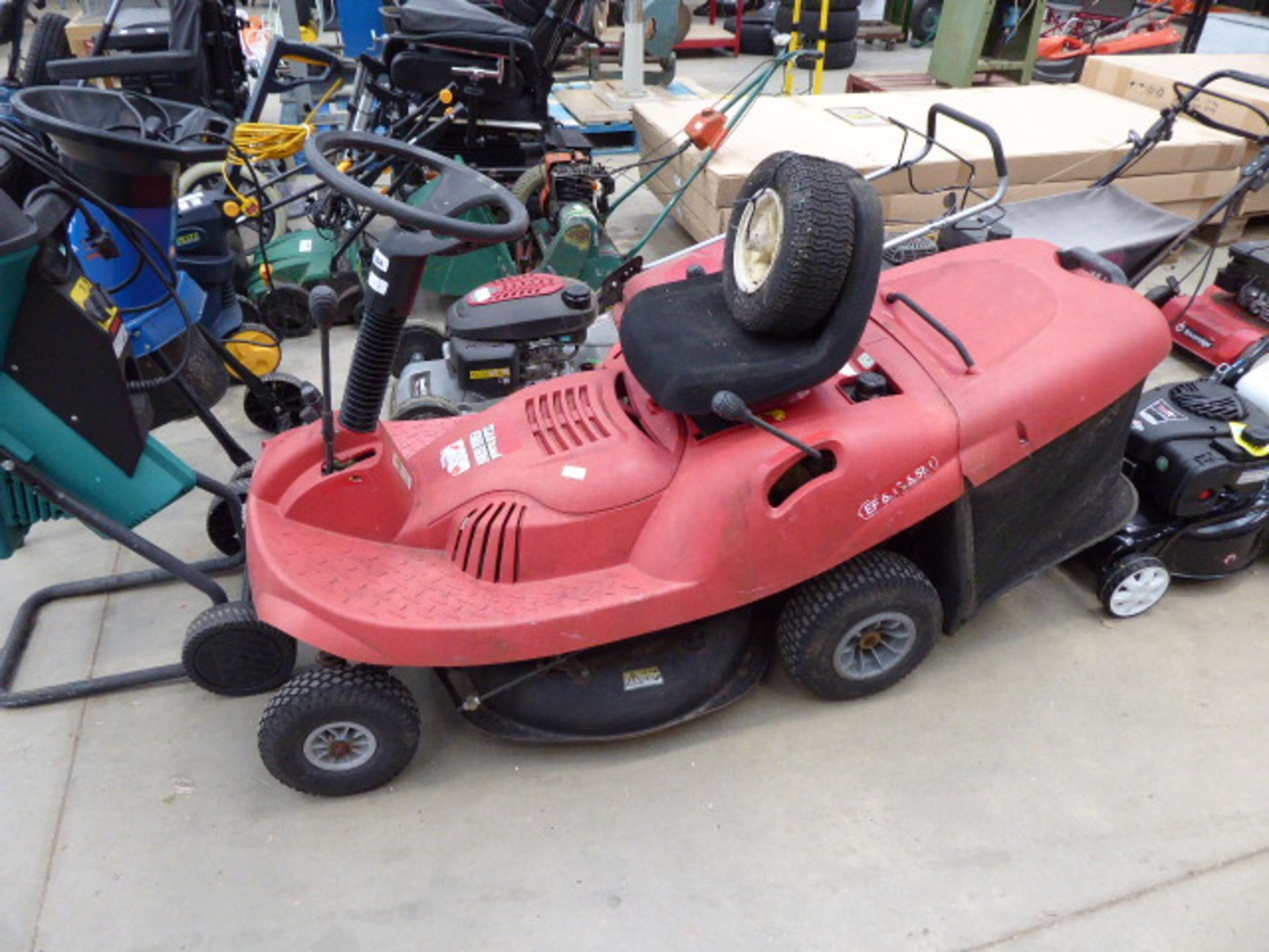 Red petrol powered ride on mower