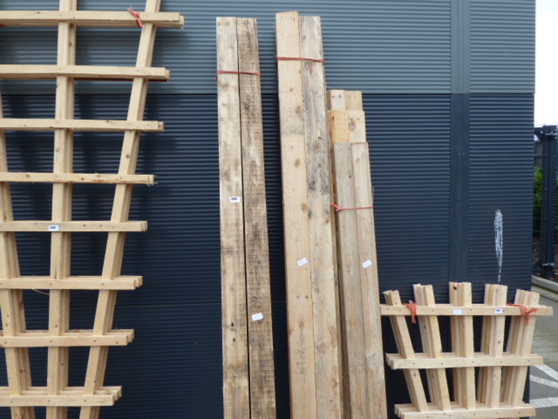 Three large bundles of pallet wood