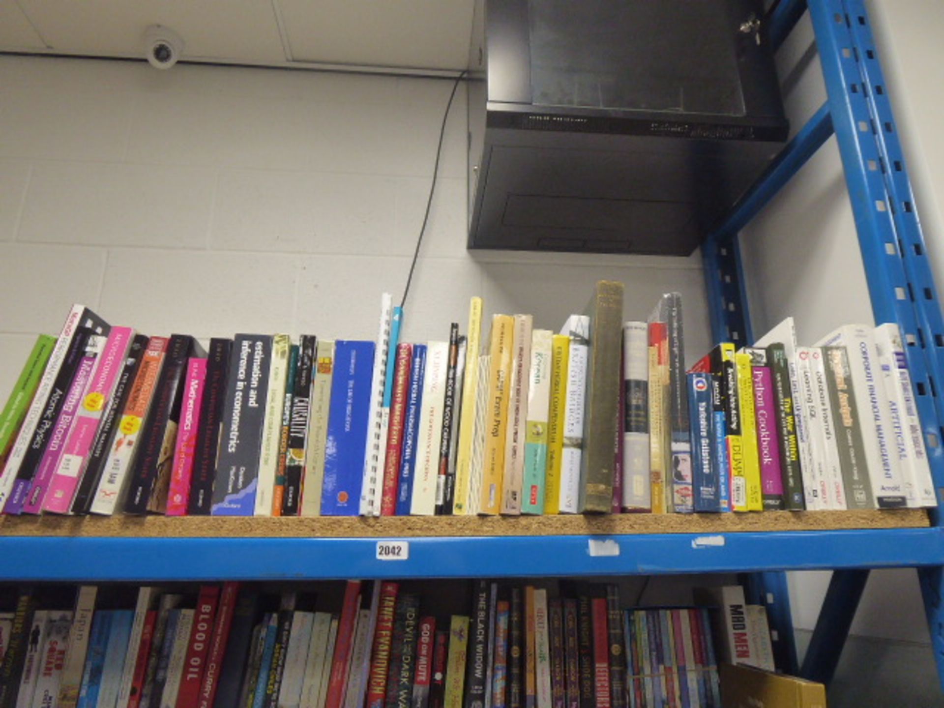 Shelf of reference and other study books.