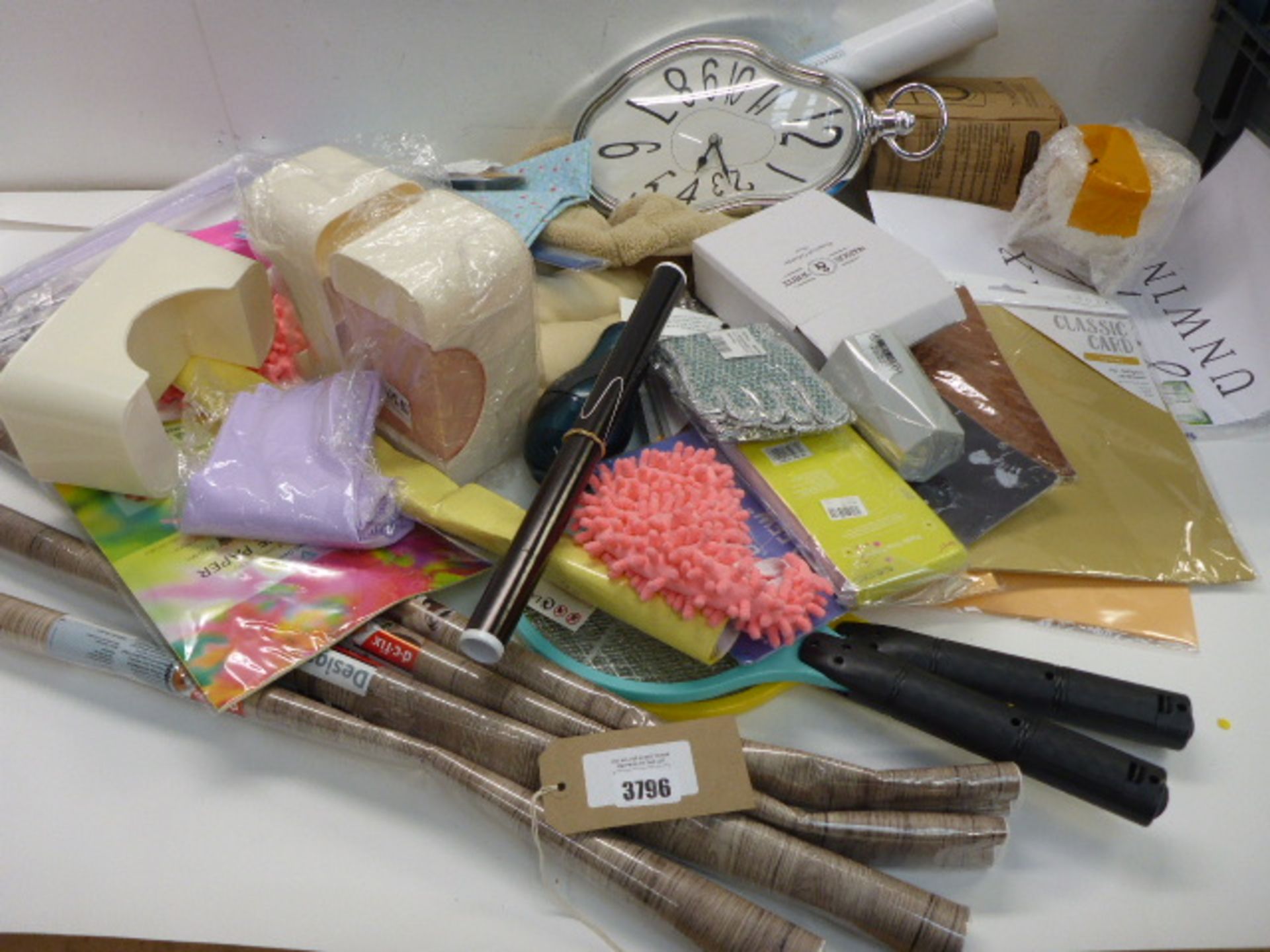Large bag of household sundries, sticky back plastic, wonky clock, craft paper etc