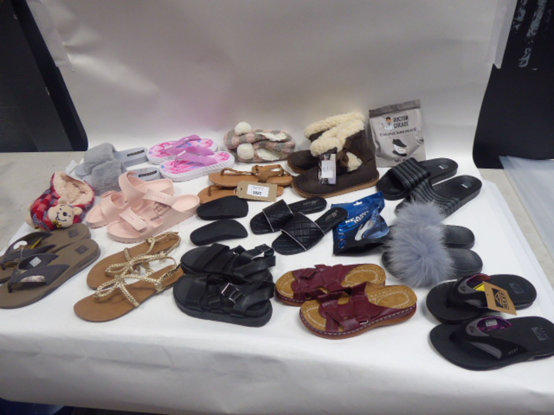 Bag of assorted paired slippers, sandals and shoe accessories