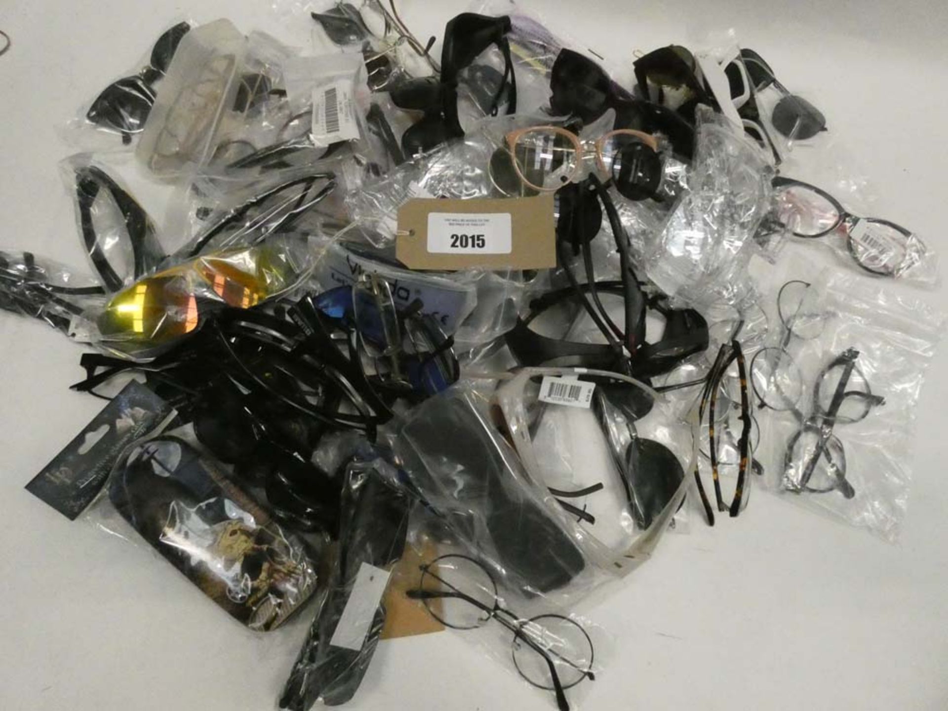 Bag containing quantity of various sunglasses and reading glasses