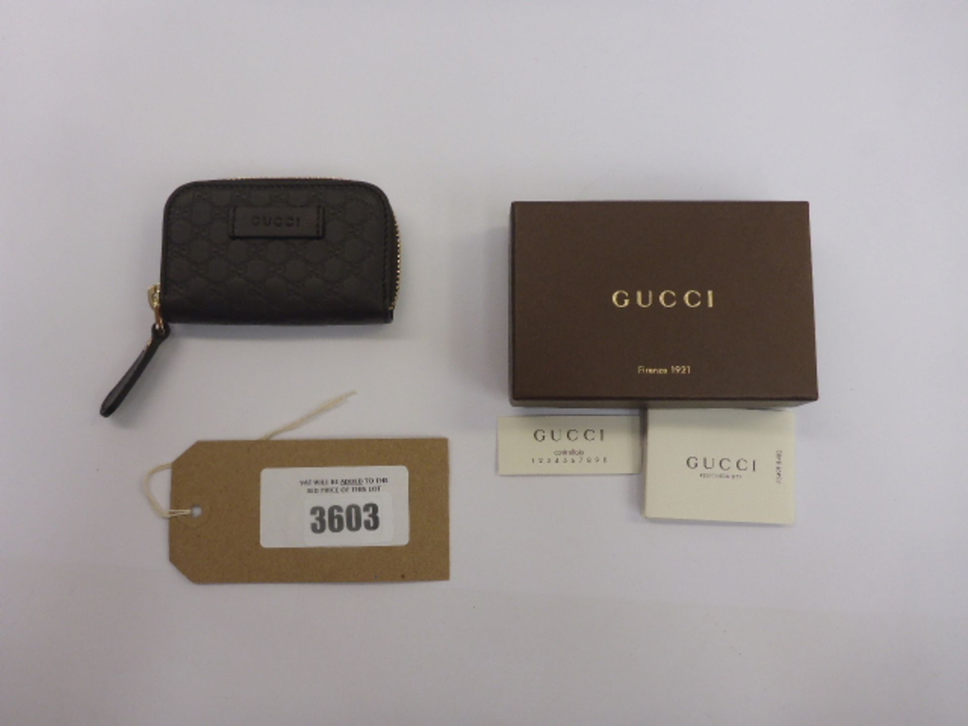 Gucci brown leather monogram purse