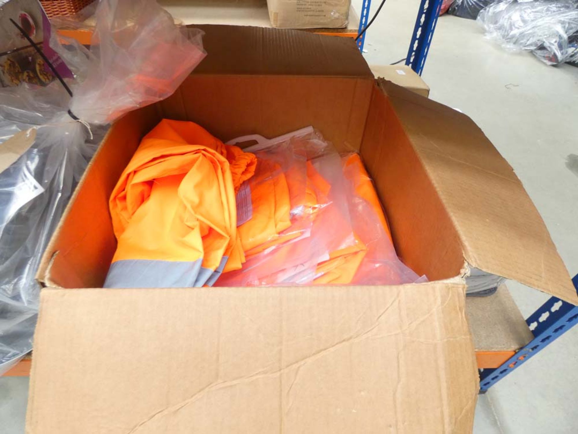 Box containing approx 20 pairs of high vis waterproof over trousers