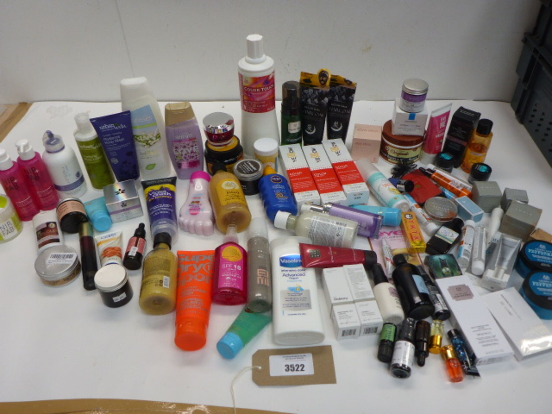 Large bag of toiletries including shampoo, conditioner, body wash, moisturizer, cleanser,