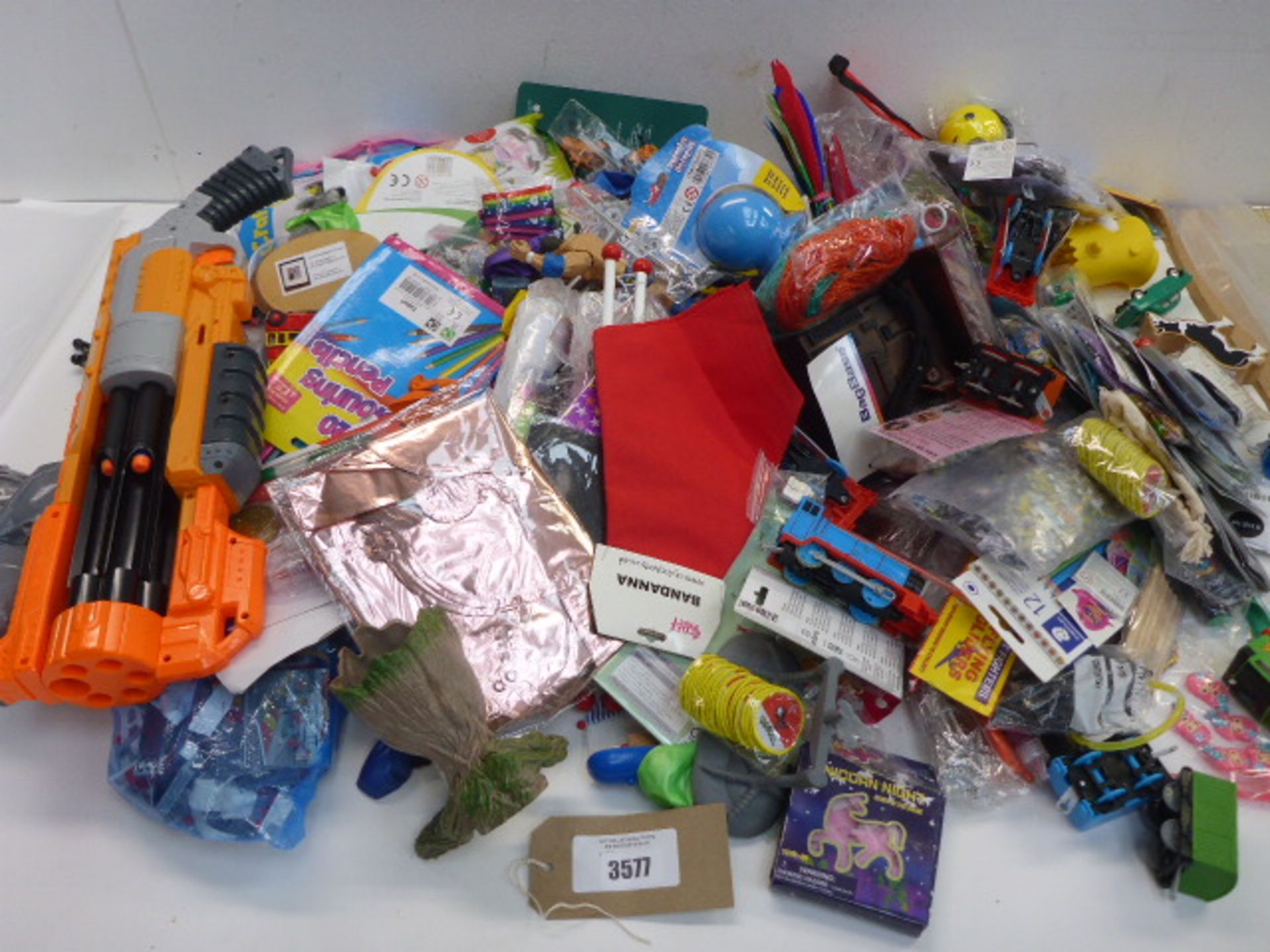 Large bag of novelty toys, action figures, Nerf gun, balloons, sticks, pencils, pens, stickers,