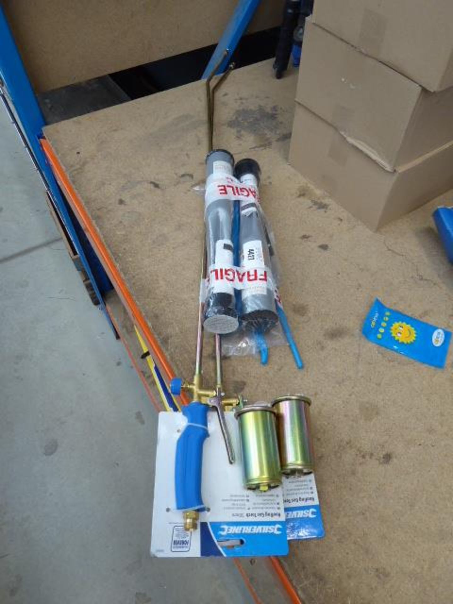 2 roofing gas torches, set of pliers and 2 rotaryclothes line spikes