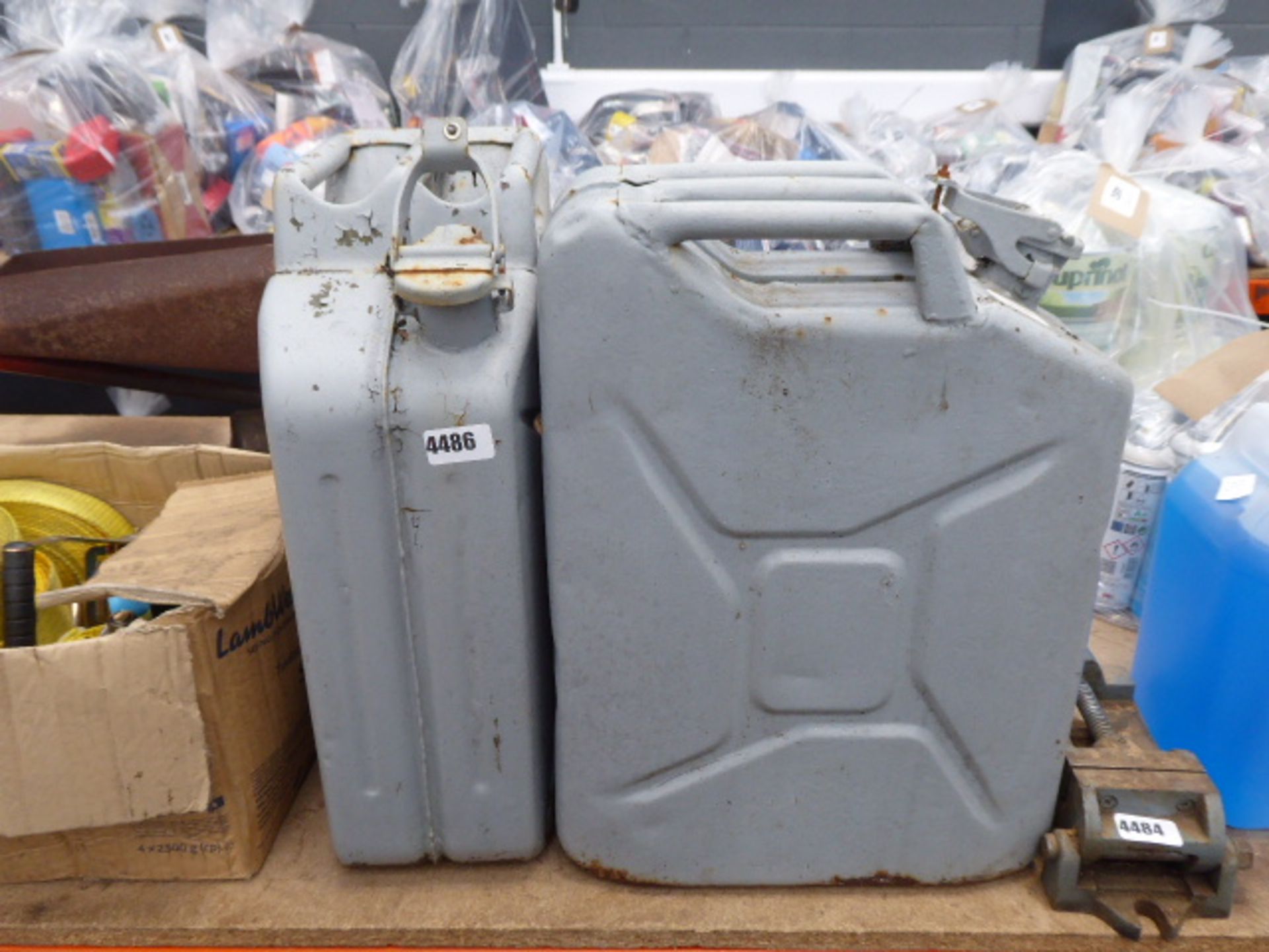 2 grey metal jerry cans