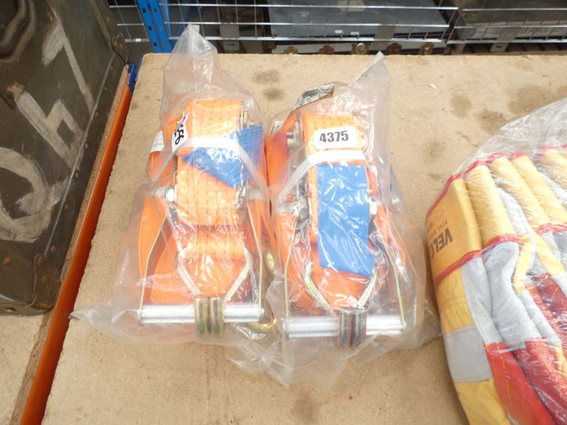 2 orange lorry straps